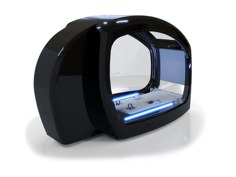A sleek black rehabilitation chamber with a futuristic design, featuring a large curved glass front with "Rehab chamber" written on it. The interior is illuminated with blue LED lights, showcasing a modern and advanced setup ideal for therapeutic purposes.