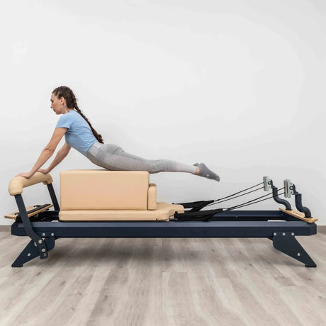 HEGREN Box Modern placed on a Pilates Reformer, showcasing its cushioned surface and modern design.