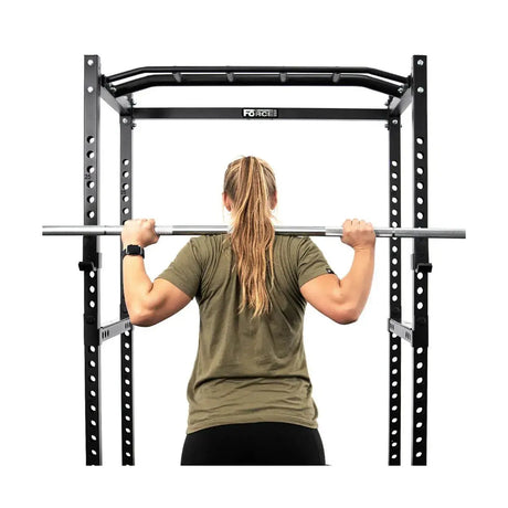 Force USA PT V2 Power Rack with integrated lat pulldown and low row attachment, featuring a sturdy steel frame and adjustable components.

